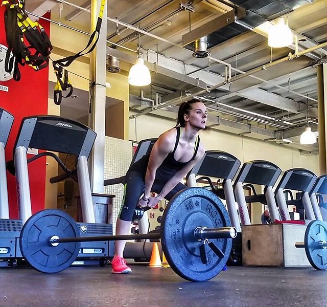 Member lifting a barbell