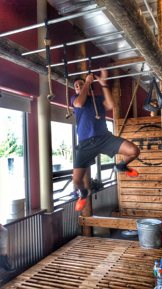 Member climbing the rope