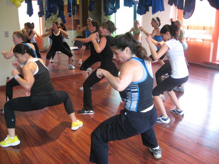 Boot camp class doing lunges